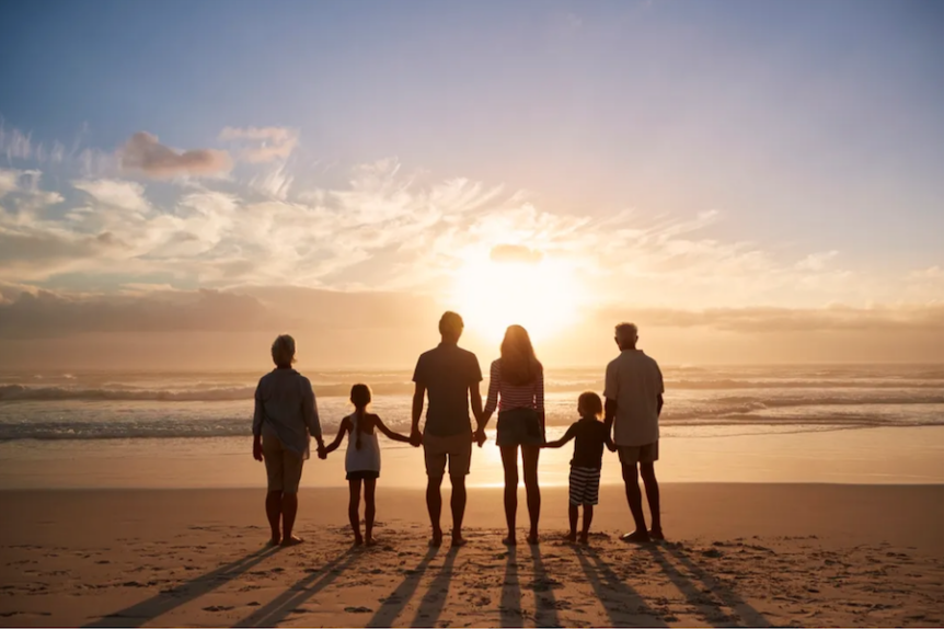 family on beach together